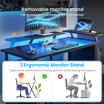 Black DOMSHOCT gaming desk with LED lights, power outlets, storage shelves, and reversible design, ideal for home office or study.