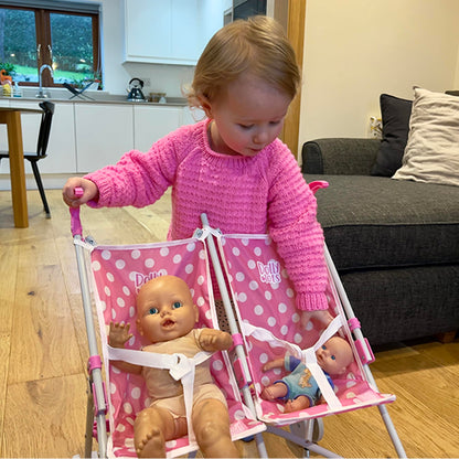 Pink Dolly Tots twin stroller with polka dots, lightweight foldable double dolls pram for kids aged 2+ perfect for role play.