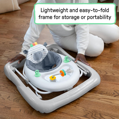 Ingenuity Smooth Strides Activity Walker in chambray with toys, 3-position heightbar, suitable for babies 6-12 months.