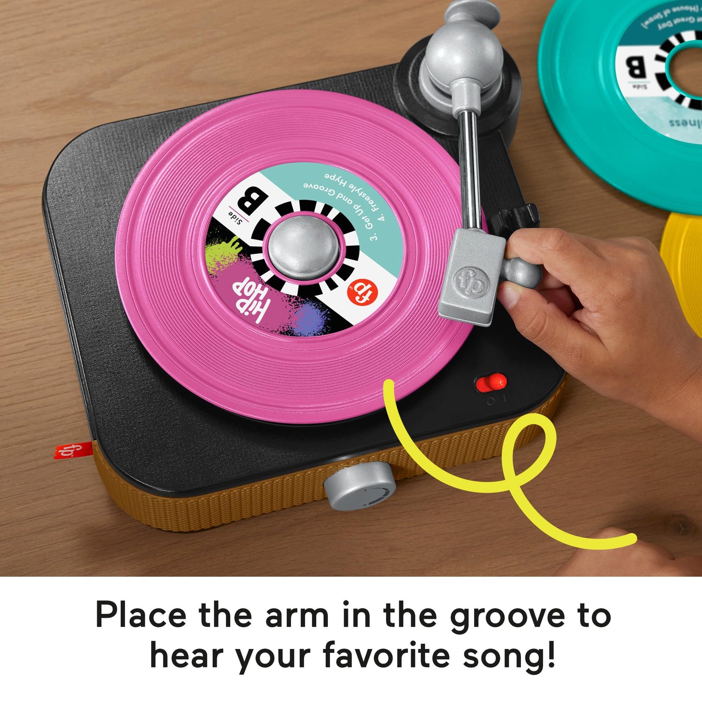 Fisher-Price Musical Toy Rockin’ Record Player for preschool kids, featuring colorful buttons and pretend play accessories.