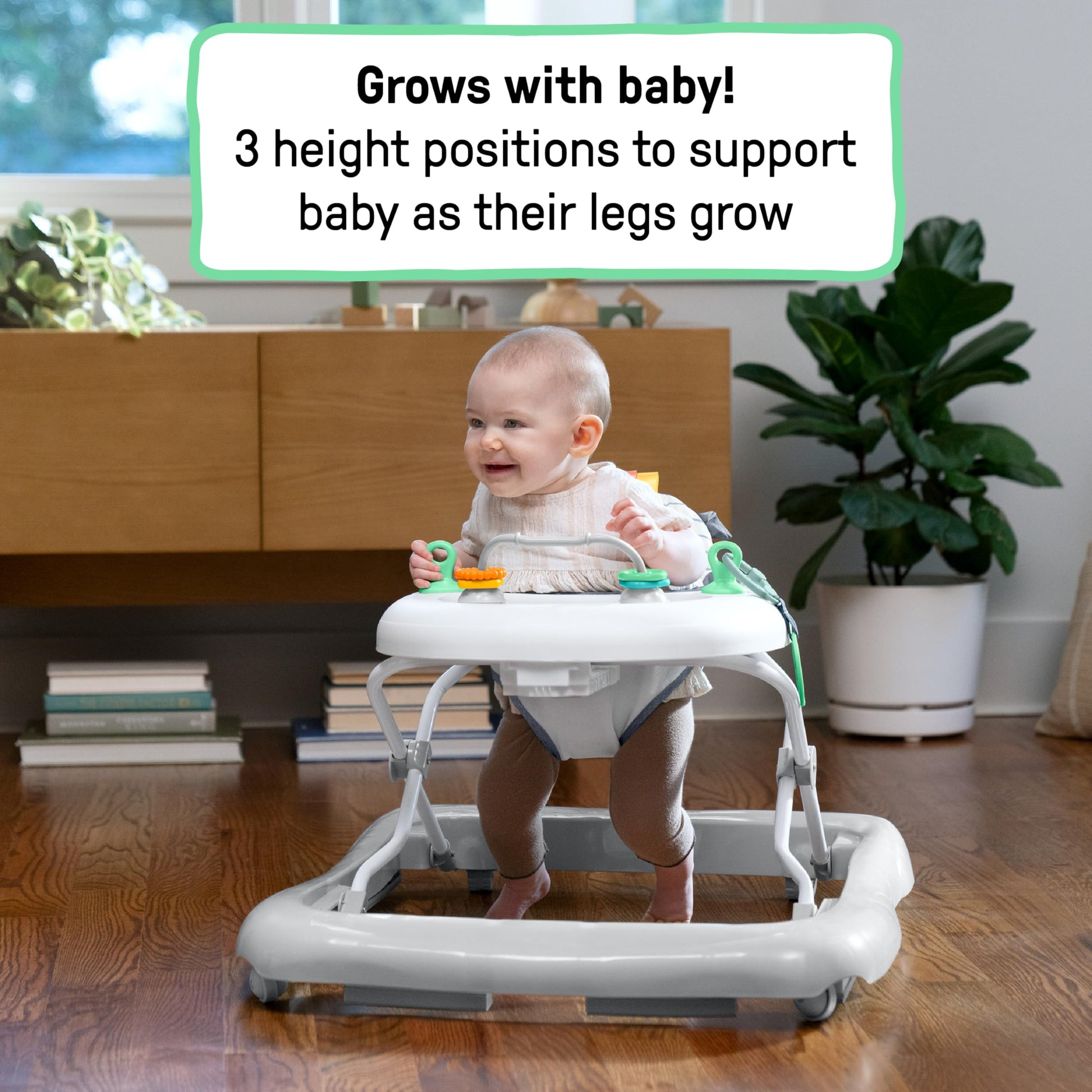 Ingenuity Smooth Strides activity walker in chambray with toys, 3-position height adjustment for babies 6-12 months.
