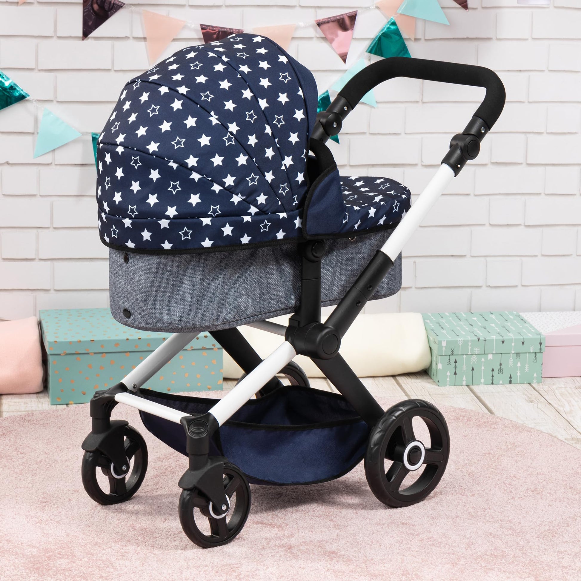 Bayer Baby Dolls Pram XEO in navy blue with white stars, convertible doll stroller with carrycot, changing bag, and adjustable handle.