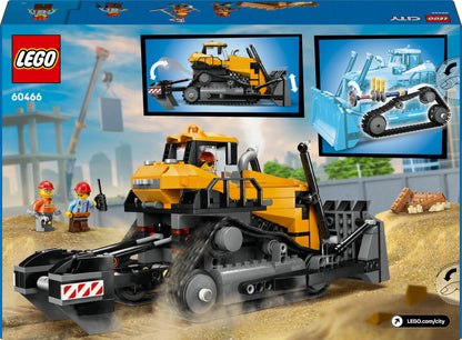 LEGO City yellow bulldozer toy with three minifigures, loose bricks, and road signs in a vibrant construction scene.