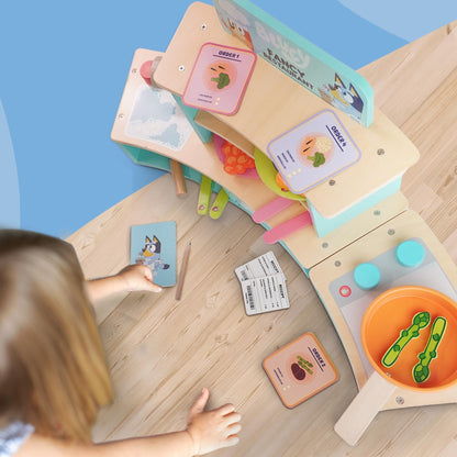 Bluey wooden tabletop restaurant playset with oven, sink, fridge, and accessories for kids' imaginative role play.