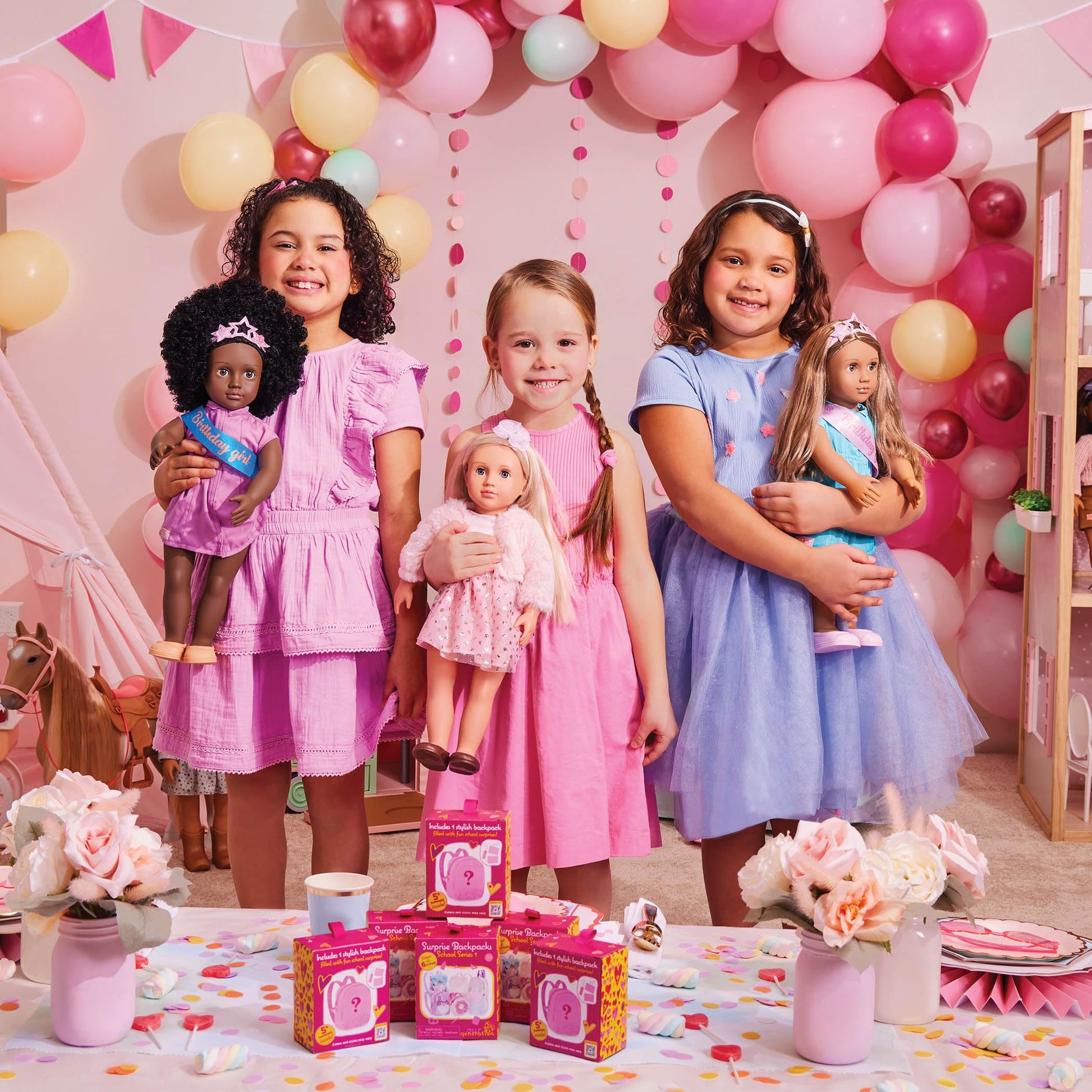 Our Generation Maria fashion doll in pink pyjama onesie holding elephant plush toy, posable doll for children aged 3 to 12.