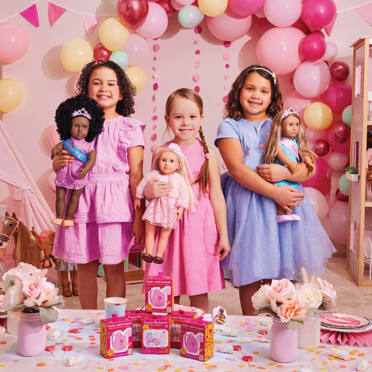 Our Generation 18-inch doll birthday set featuring a colorful cake, balloons, and pretend food for imaginative play.
