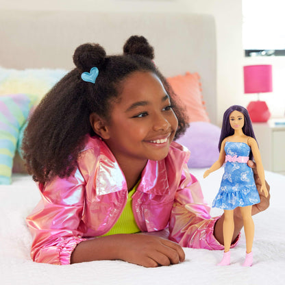 Barbie Fashionistas Doll #231 with purple hair in a strapless denim butterfly-print dress and pink belt and boots.