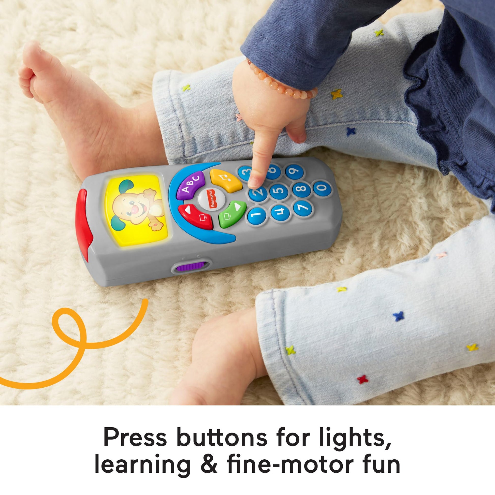Fisher-Price Laugh and Learn remote toy with light-up screen, push buttons, and 35+ sing-along songs for baby early development.
