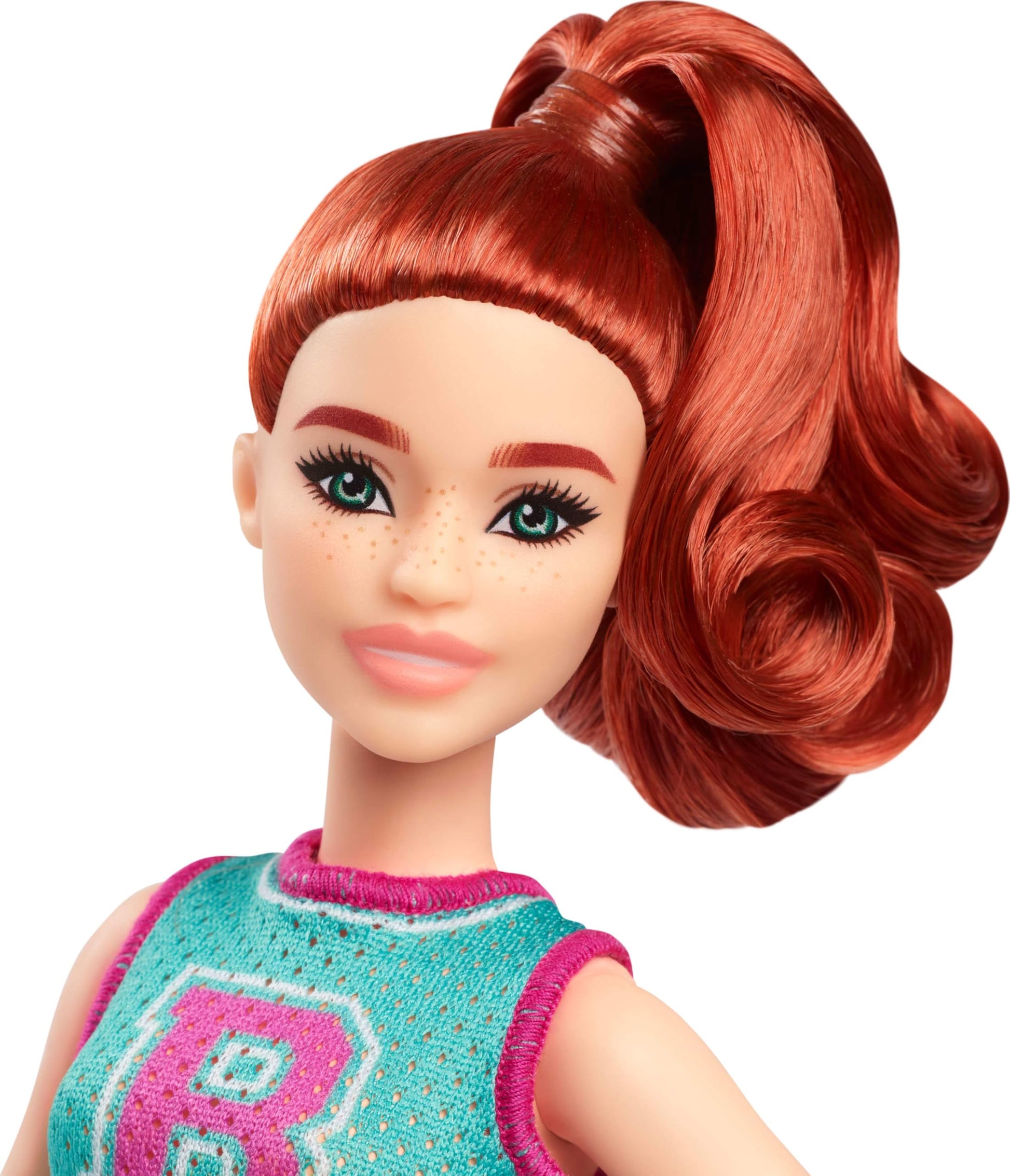 Barbie Fashionistas Doll #232 with red hair, sporty "B" jersey, pleated purple skirt, watch, and sneakers.