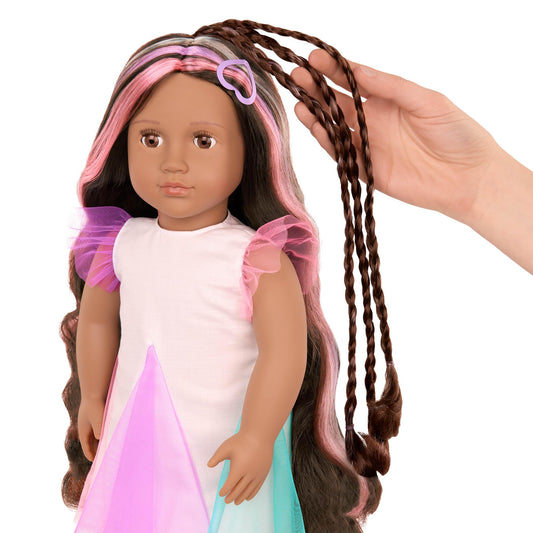 Our Generation 18-inch doll Tania with lifelike brown eyes and ultra-long rainbow hair styled with accessories.