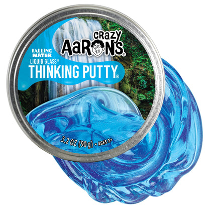 Crazy Aaron's Liquid Glass Thinking Putty in Falling Water, crystal clear blue, with a smooth, glossy, and moldable texture.