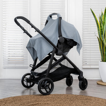 Comfy Cubs baby car seat cover in Pacific Blue, soft and breathable muslin cotton canopy for sun protection and infant travel.