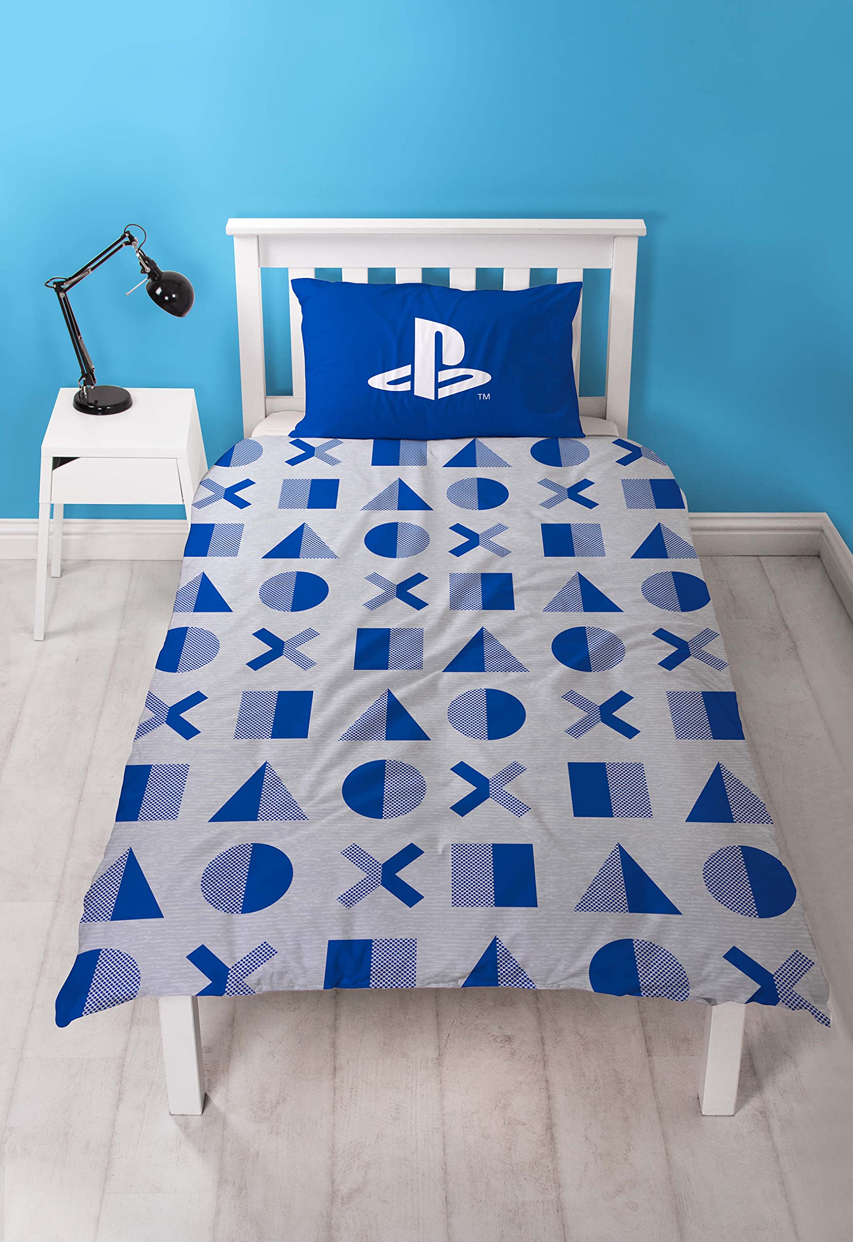 Reversible PlayStation Official duvet cover with layered design and pillow case, featuring gaming-themed graphics on both sides.