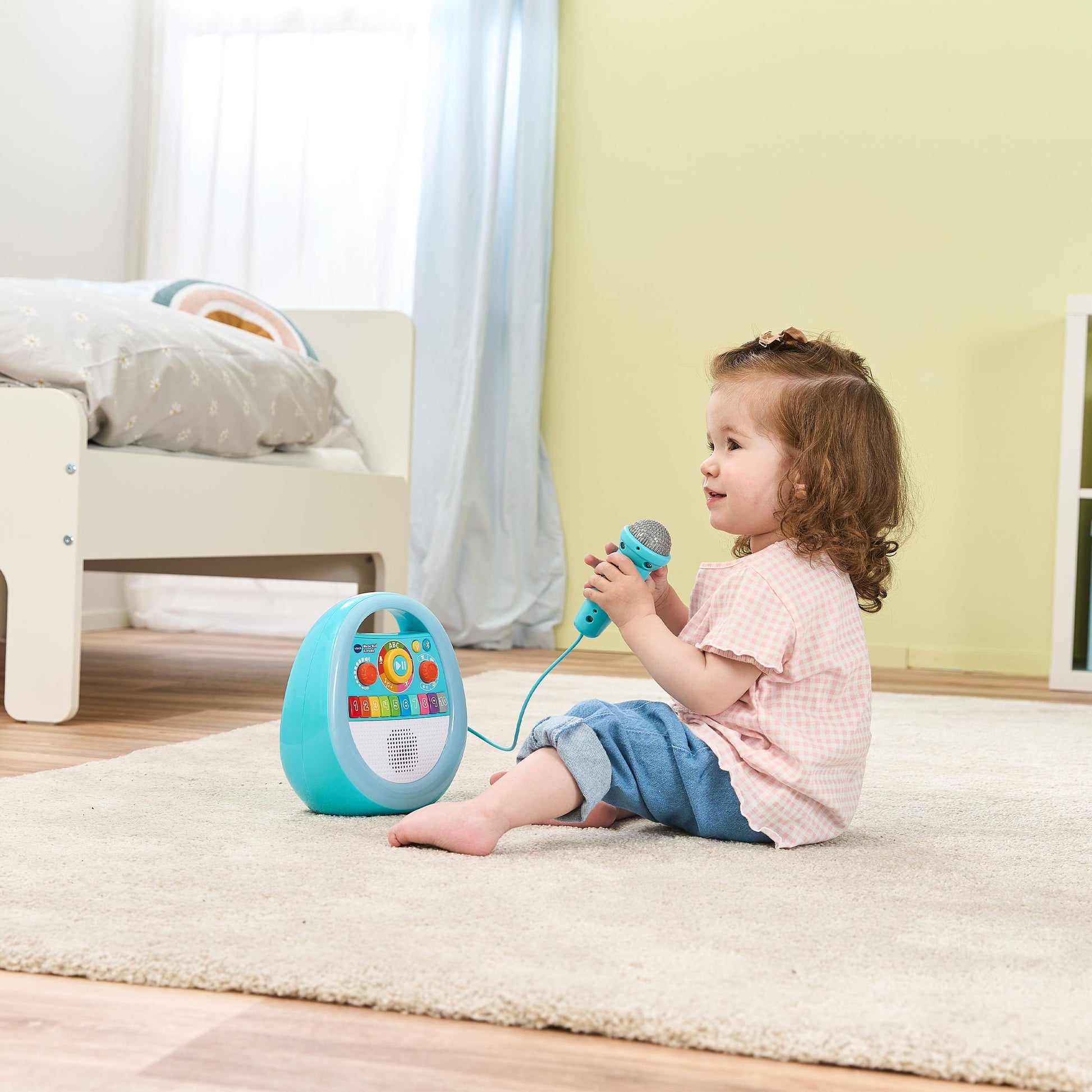 VTech My First Music Player with colorful buttons and microphone for karaoke fun, designed for young children.