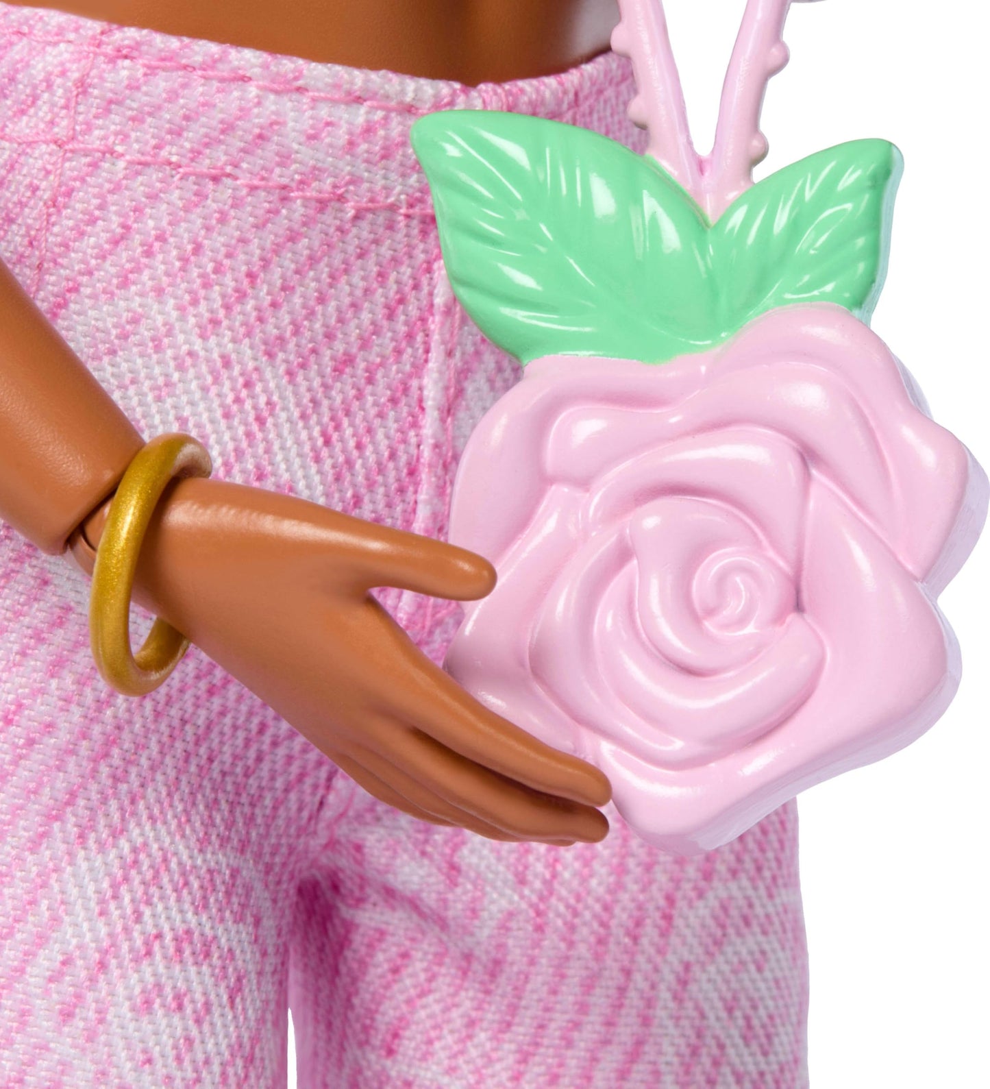 Barbie Deluxe Style Doll #12 in pink denim crop top and rose print jeans, featuring wavy brown hair and accessories.