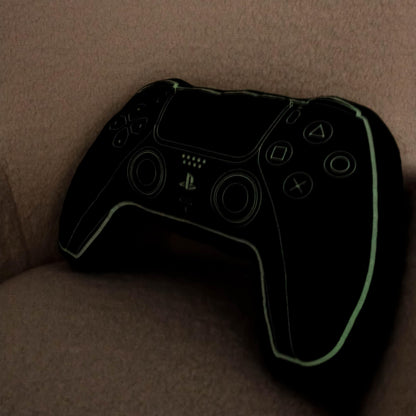 PlayStation licensed black controller-shaped plush cushion pillow with glow-in-the-dark features, ideal for bedroom or gaming décor.