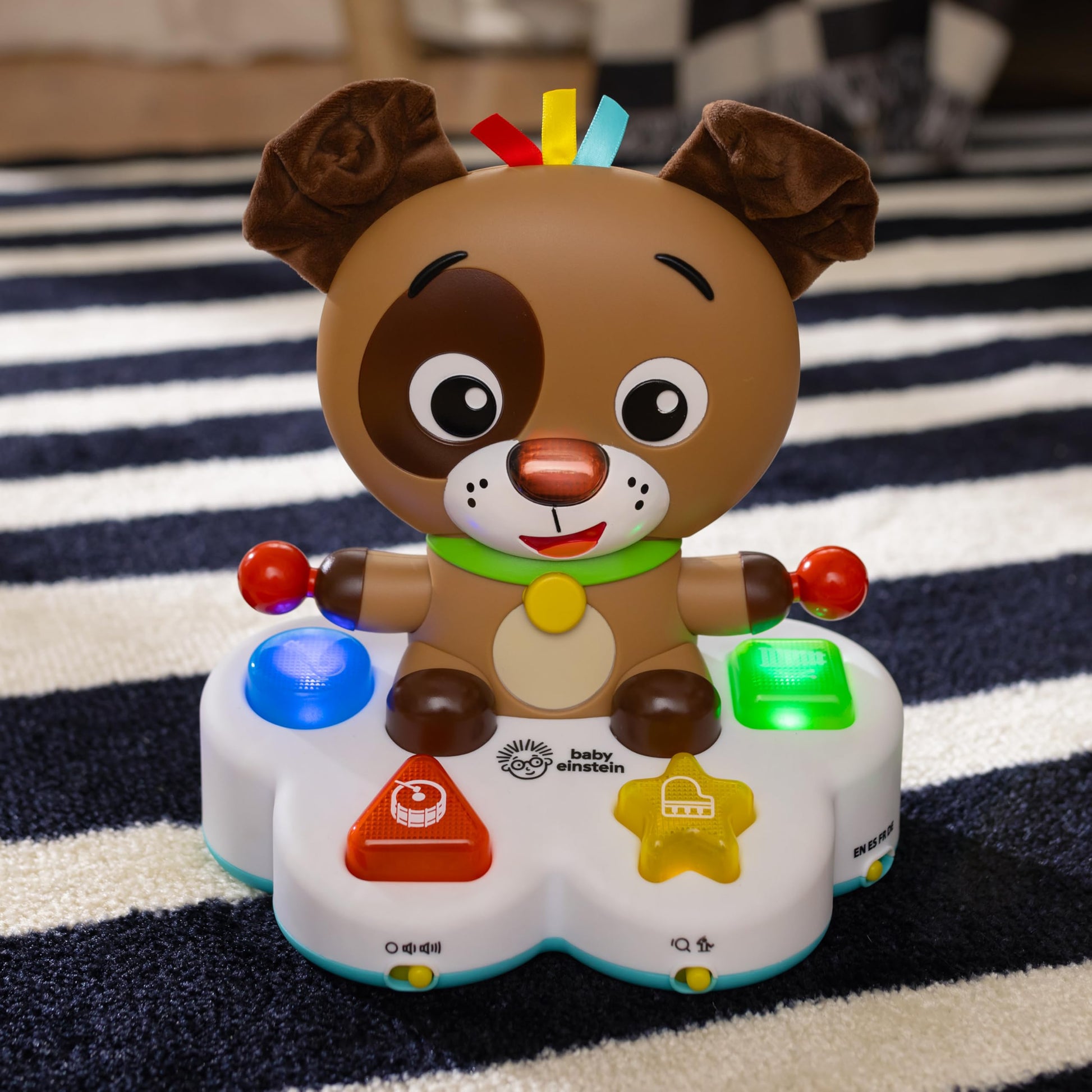 Baby Einstein Drum & Learn Dean musical toy with colorful buttons and sensors, designed for multisensory learning for babies 6 months and up.