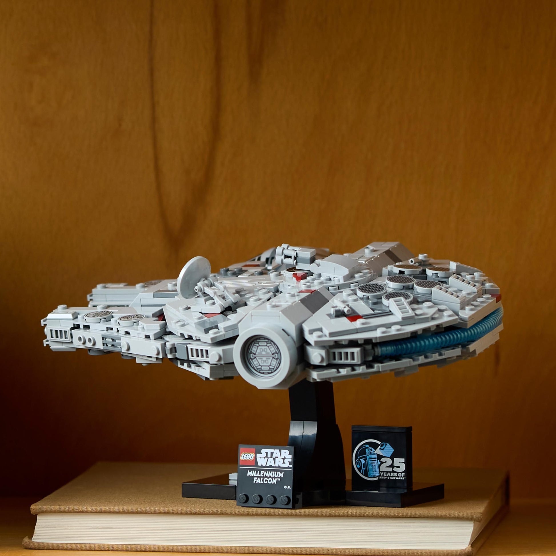 LEGO Star Wars 75375 Millennium Falcon building set displayed with stand and nameplate, ideal for A New Hope fans.
