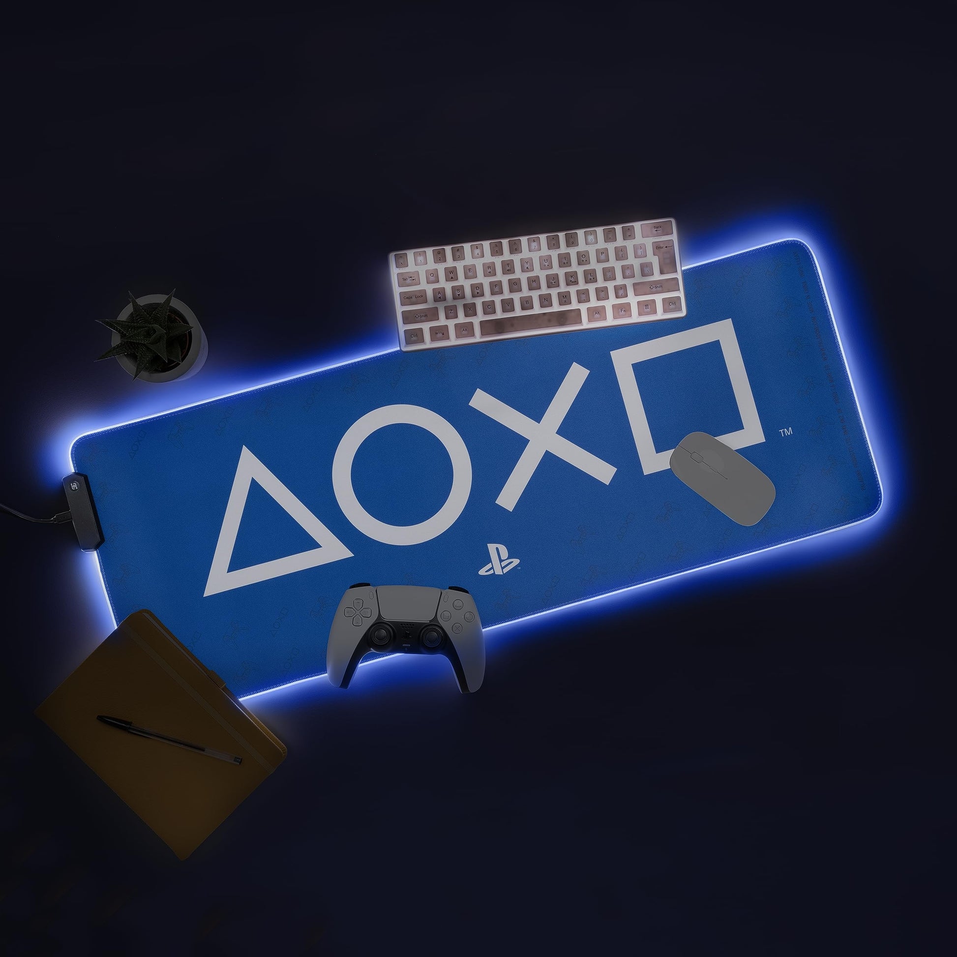 Paladone PlayStation light-up desk mat featuring a large gaming mouse pad with illuminated design and smooth surface for keyboard and mouse.