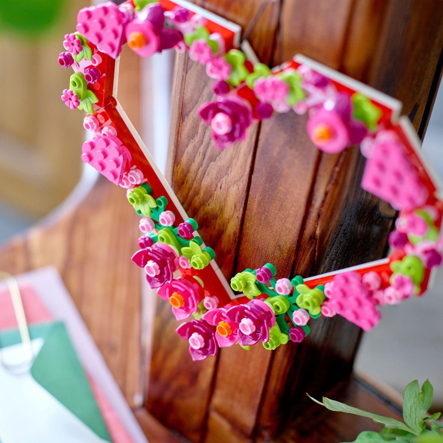 LEGO Heart Ornament Toy arts and crafts kit with colorful flowers, leaves, and smaller hearts for kids aged 9 and up.