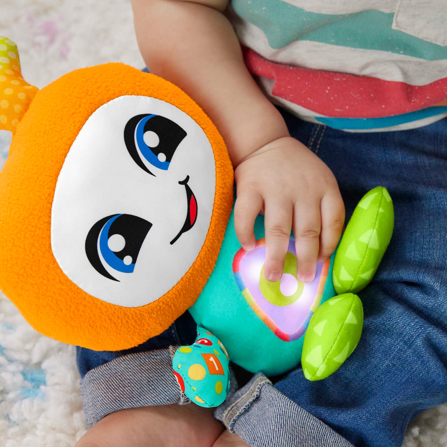 Fisher-Price DJ Groovin' Go baby learning toy with music, lights, and sounds for children 6+ months, UK English version.