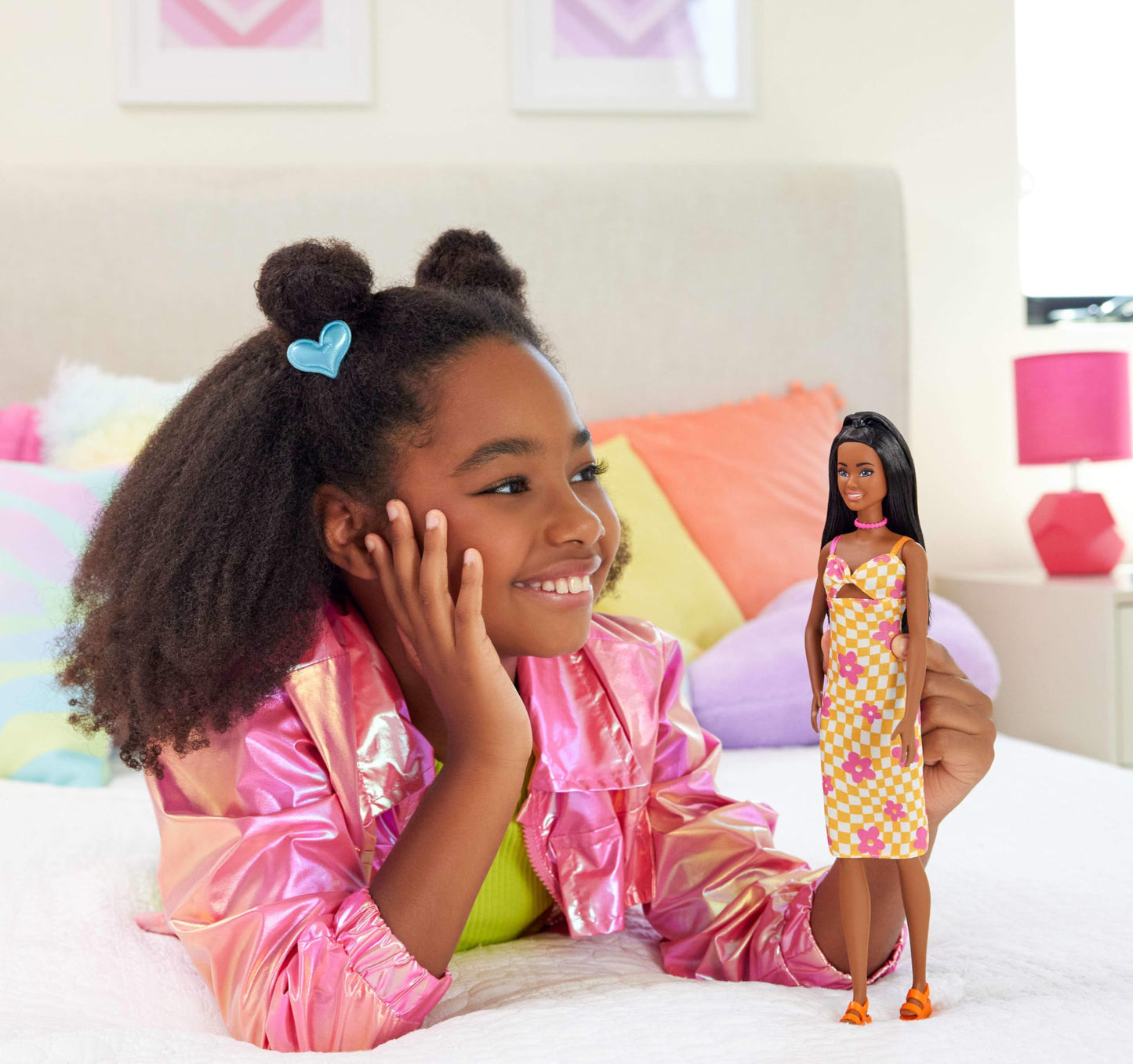 Barbie Fashionistas Doll #233 with black hair in a checkered orange and pink flower midi dress, necklace, and sandals.