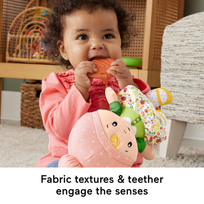 Fisher-Price baby sensory toy cuddle and chime first babydoll for infants 6+ months, soft fabric with colorful details.