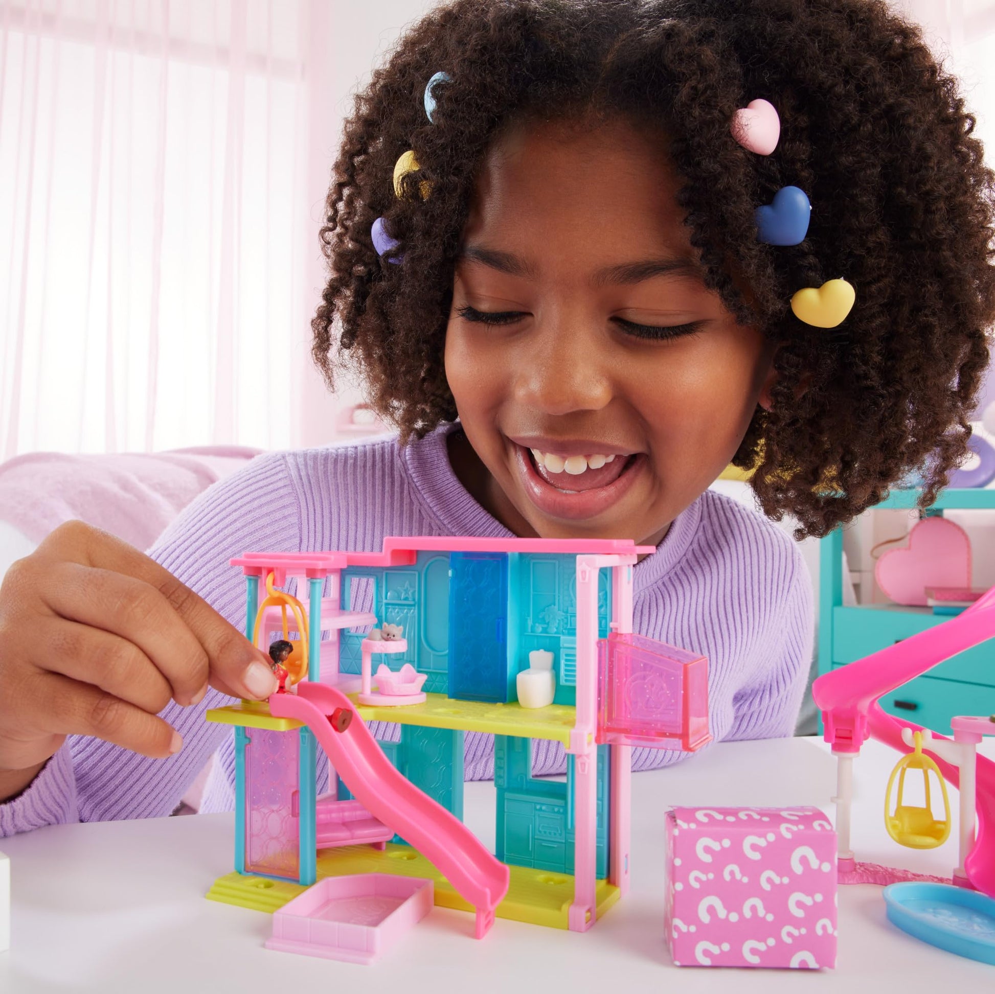 Mini Barbie Dreamhouse set with 1.5-inch Barbie doll, furniture, elevator, and pool, perfect for ages 4 and up.
