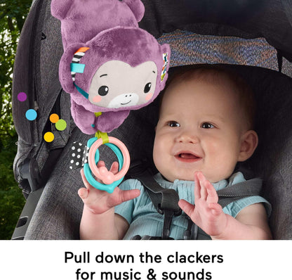 Fisher-Price baby stroller toy featuring a purple monkey plush with crinkle fabric and clackers for newborn sensory play.