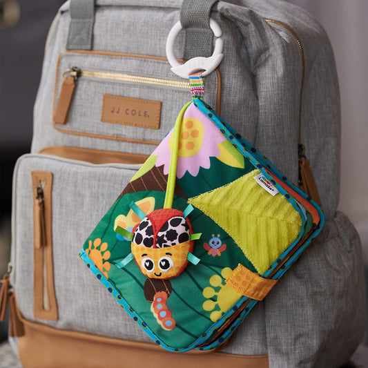LAMAZE Bitty Bug Book sensory toy with colorful pages and sounds, clip-on for prams and pushchairs for newborn babies.