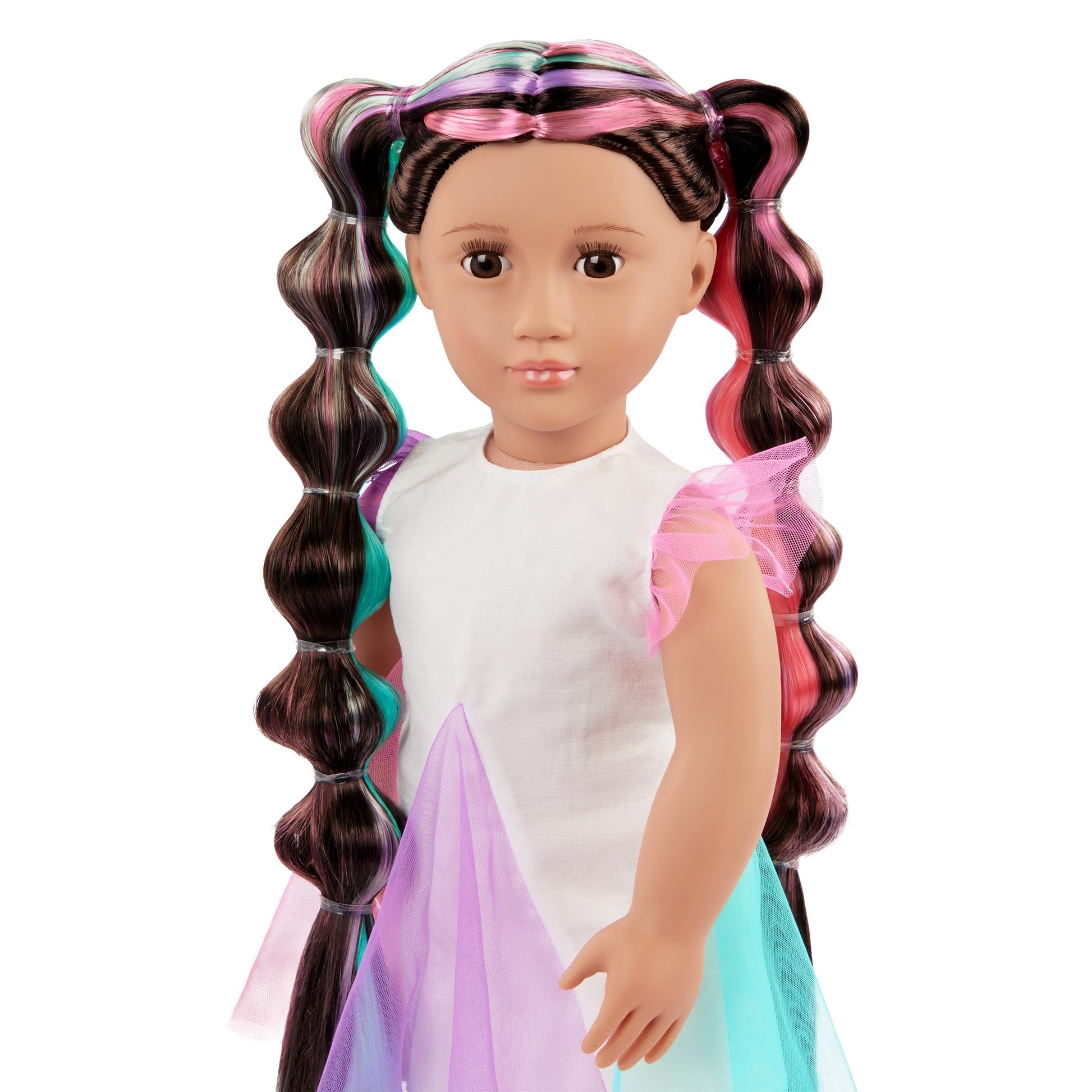 Our Generation 18-inch Hair Grow Doll Tina with lifelike brown eyes and ultra-long rainbow hair styled in an extendable braid.