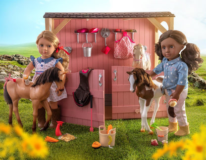 Our Generation Palomino Party Foal doll with birthday treats and 5-piece accessory set for imaginative play.
