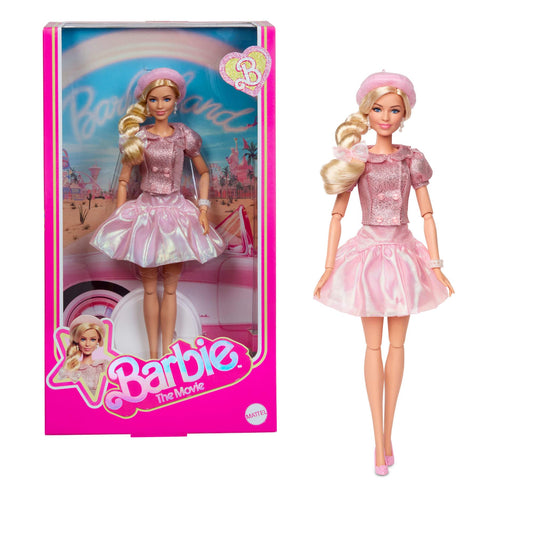 Barbie doll featuring Margot Robbie in a pink blouse, tutu skirt, styled hair, and jewelry from Barbie The Movie.