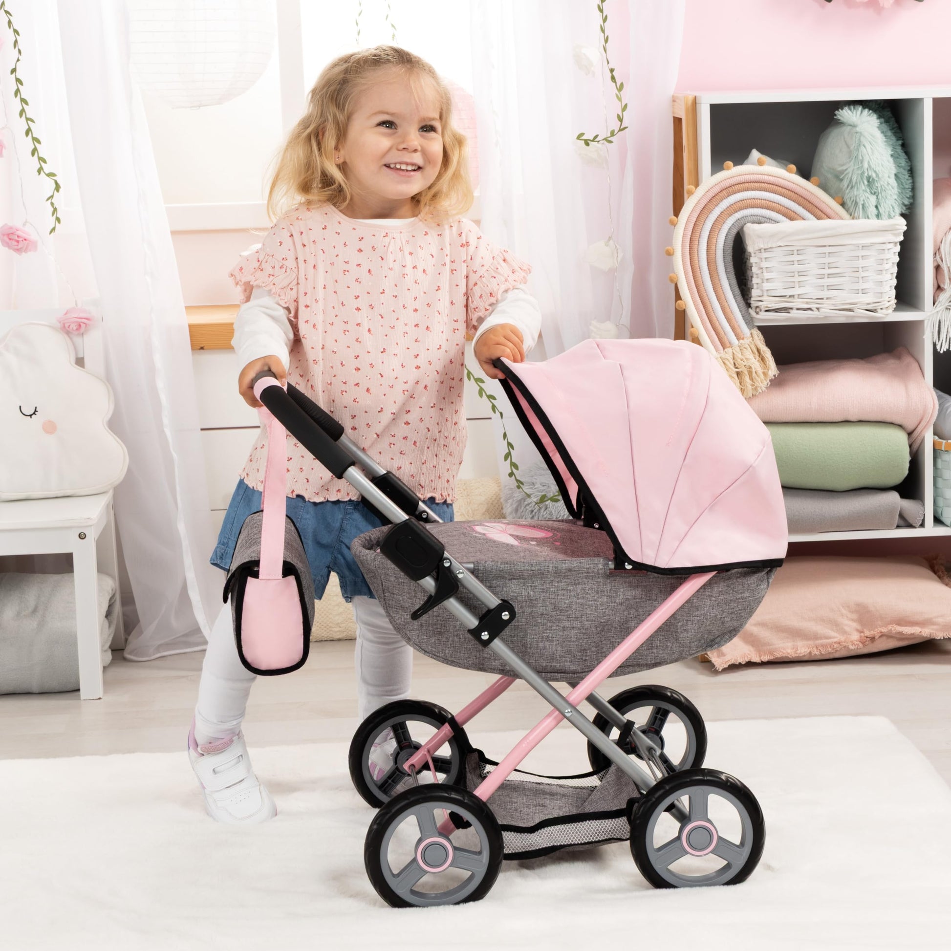 Bayer Cosy Baby Doll Pram with large wheels, foldable design, storage basket, changing bag, and accessories for 46cm dolls.
