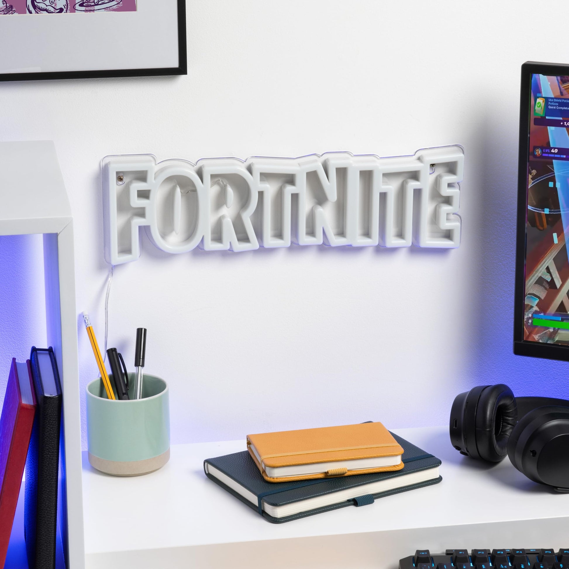 Paladone Fortnite Logo LED neon wall light with power cord, ideal for gaming decor in bedrooms or living spaces.