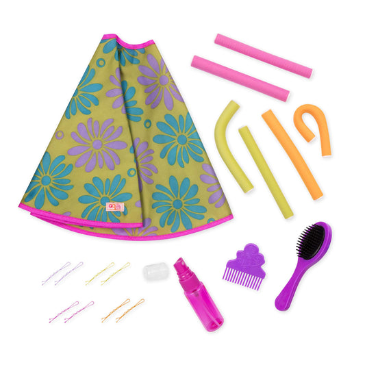 Our Generation salon set with styling cape, brush, and curlers for 18-inch dolls, perfect for creative play.