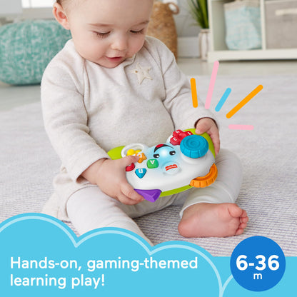Fisher-Price Laugh & Learn game controller toy in green, musical learning activity for babies and toddlers.