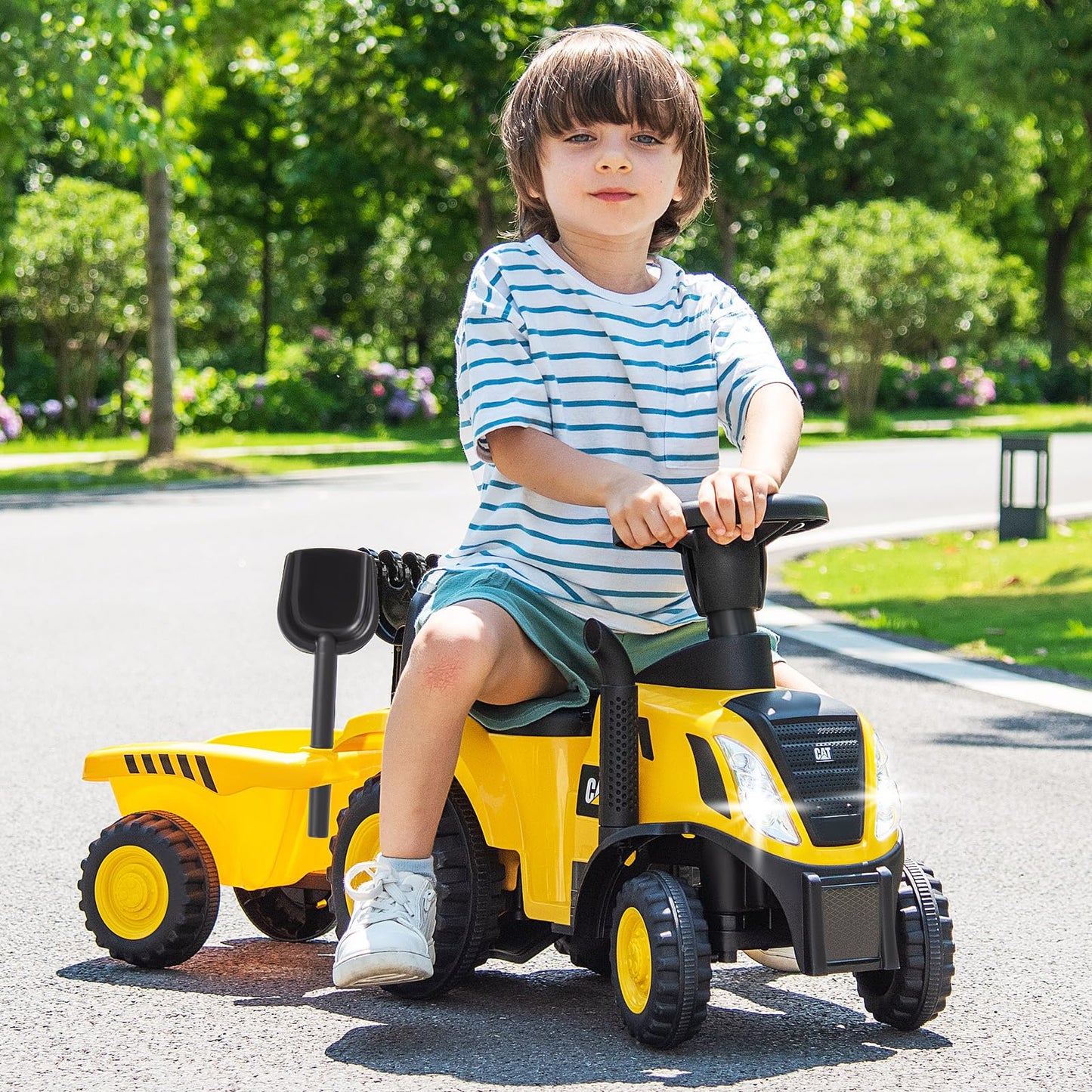 COSTWAY kids ride-on tractor with LED lights, horn, detachable trailer, rake, shovel, and foot-to-floor design for toddlers.