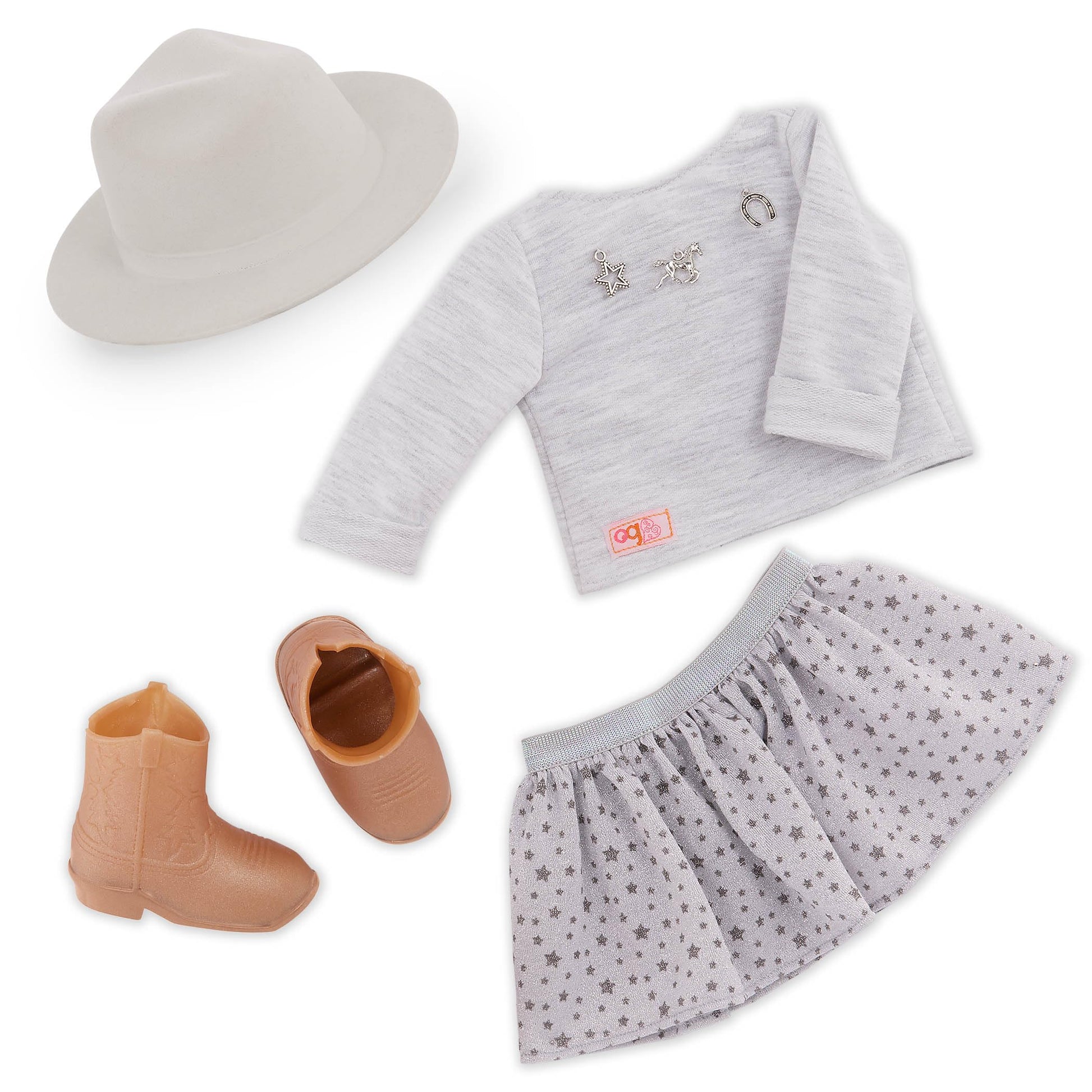 Our Generation Abigale doll with riding boots, stylish hat, and lifelike freckles in a country-themed outfit.