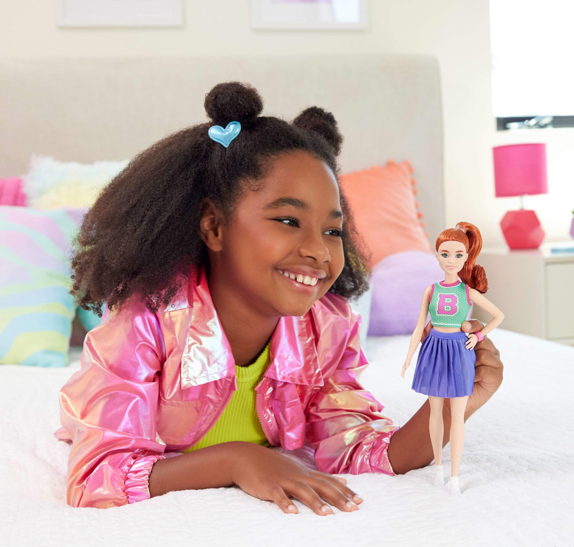 Barbie Fashionistas Doll #232 with red hair in sporty 'B' jersey top, pleated purple skirt, watch, and sneakers.