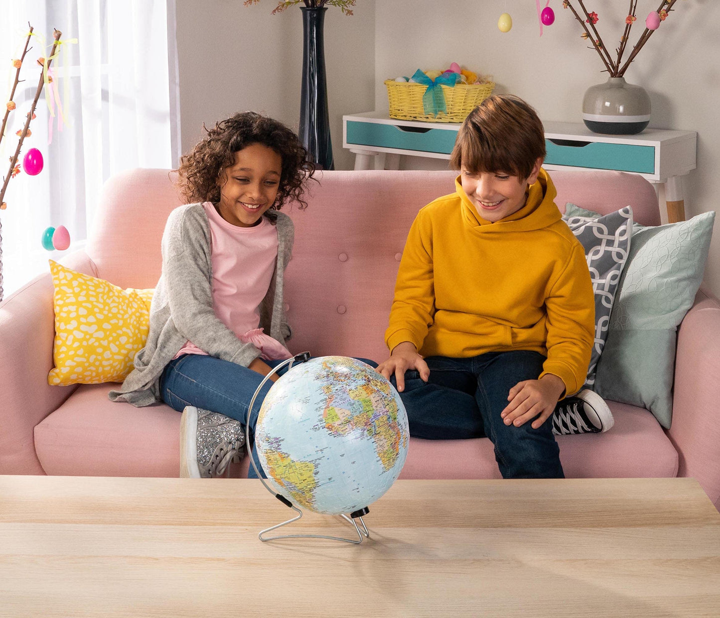 Ravensburger 3D world globe puzzle on V-stand, 540 plastic pieces, assembled showing continents and oceans, suitable for ages 10+.