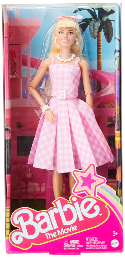 Barbie doll inspired by the movie, dressed in a pink and white gingham dress with a daisy chain necklace.