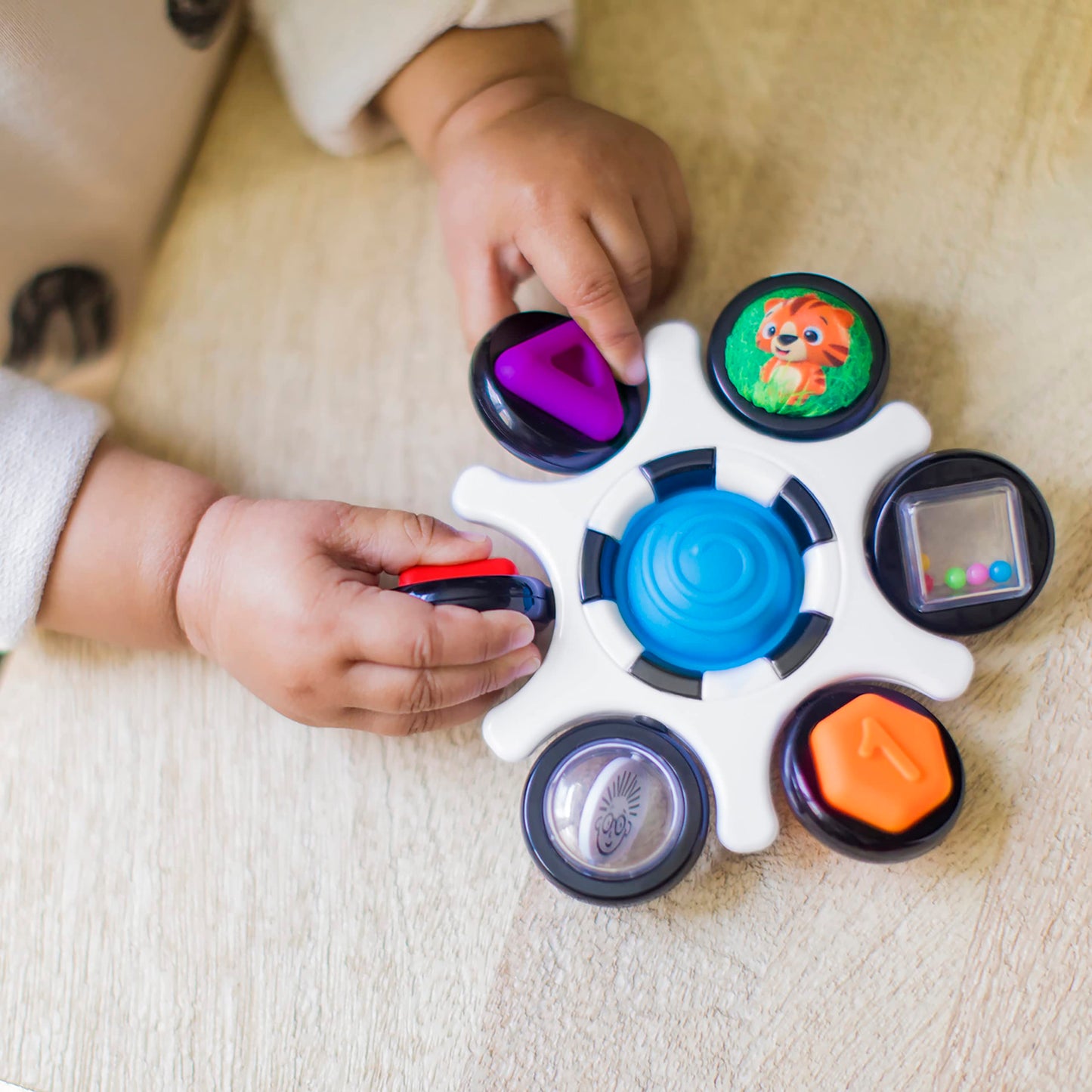 Baby Einstein Curiosity Clutch fidget toy with pop it rattle, BPA-free infant teether for babies 3 months and older.