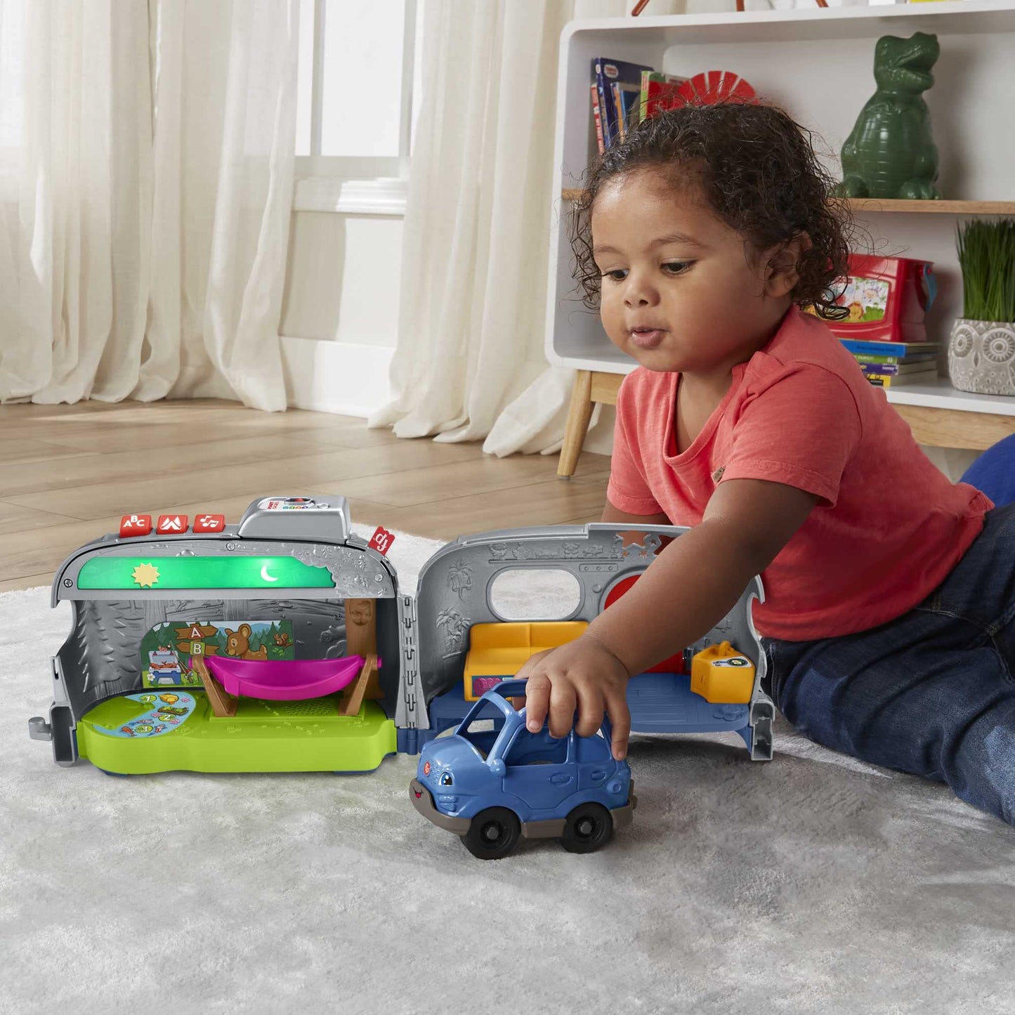 Fisher-Price Little People Light-Up Learning Camper playset with vehicle, figures, and colorful lights for children ages 1 and up