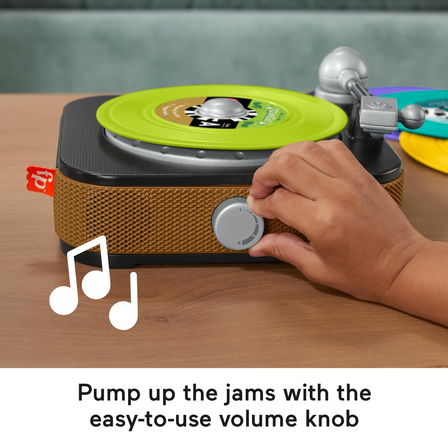 Fisher-Price musical toy rockin’ record player for preschool kids, featuring colorful buttons and pretend play design.