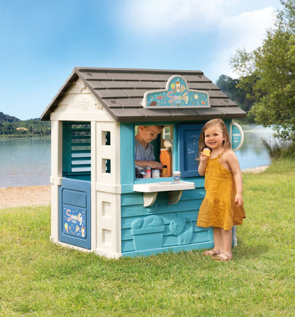 Smoby Sweety Corner House children's garden cabin with ice cream machine and accessories, made from recycled materials for kids aged 2+.