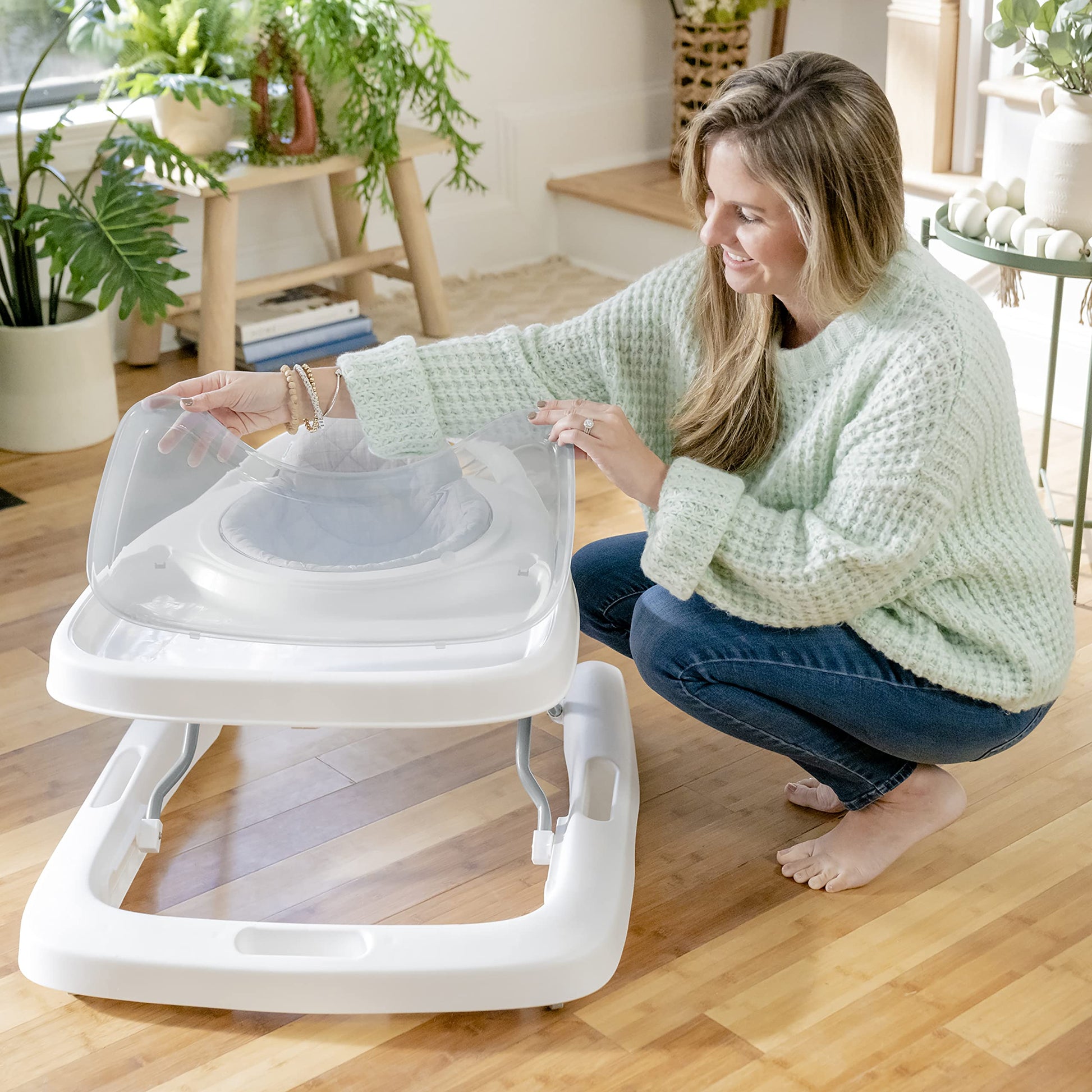 Ingenuity Spring & Sprout First Forest 3-in-1 baby activity walker with colorful toys, adjustable height, and foldable design.