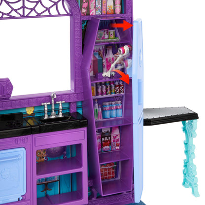 Monster High Boo-tique Hotel Doll House playset featuring spooky surprises, furniture, and accessories in vibrant rooms.