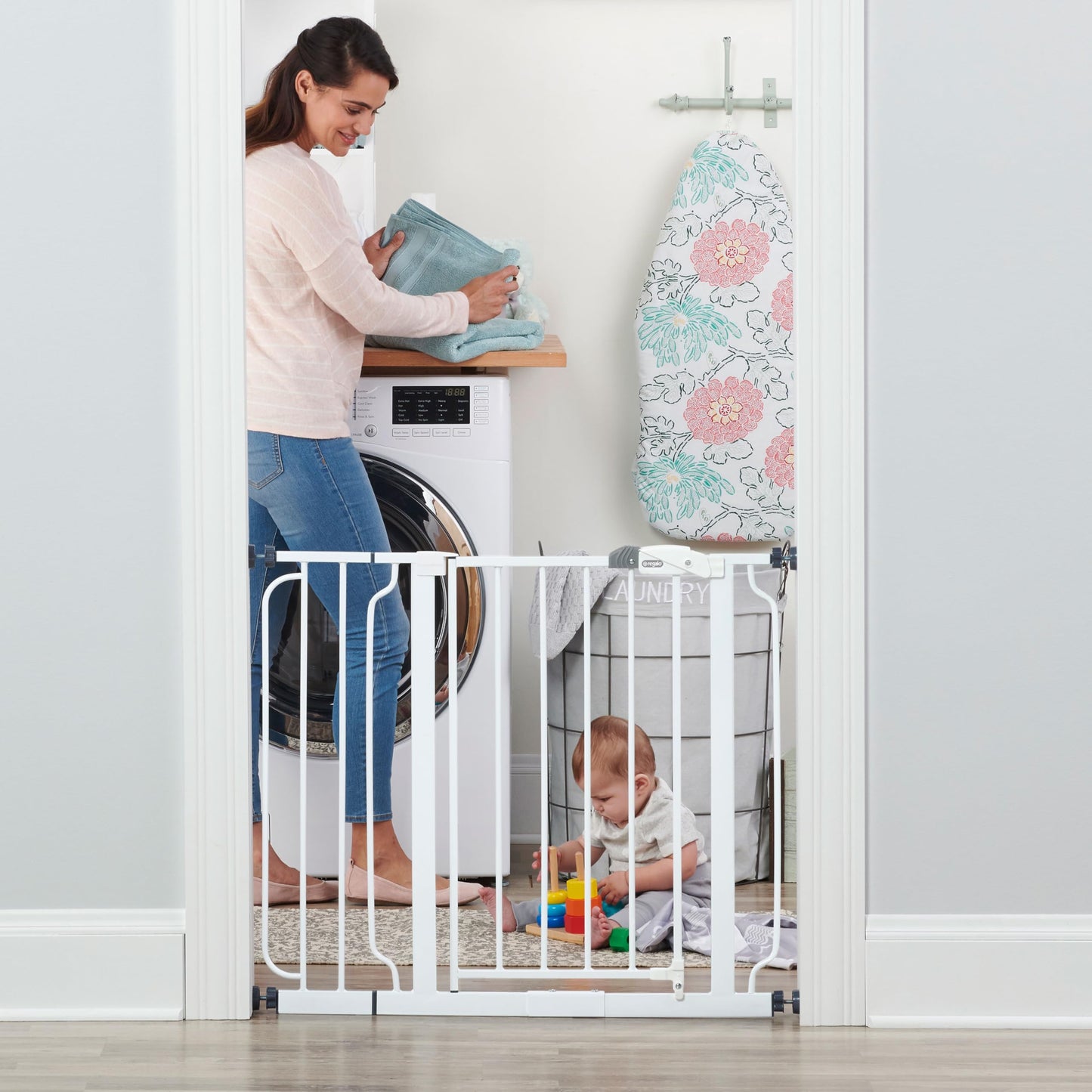 Regalo Easy Step Walk Thru baby safety gate with pressure mount and extension kit, showing the gate and installed extension in a home setting.
