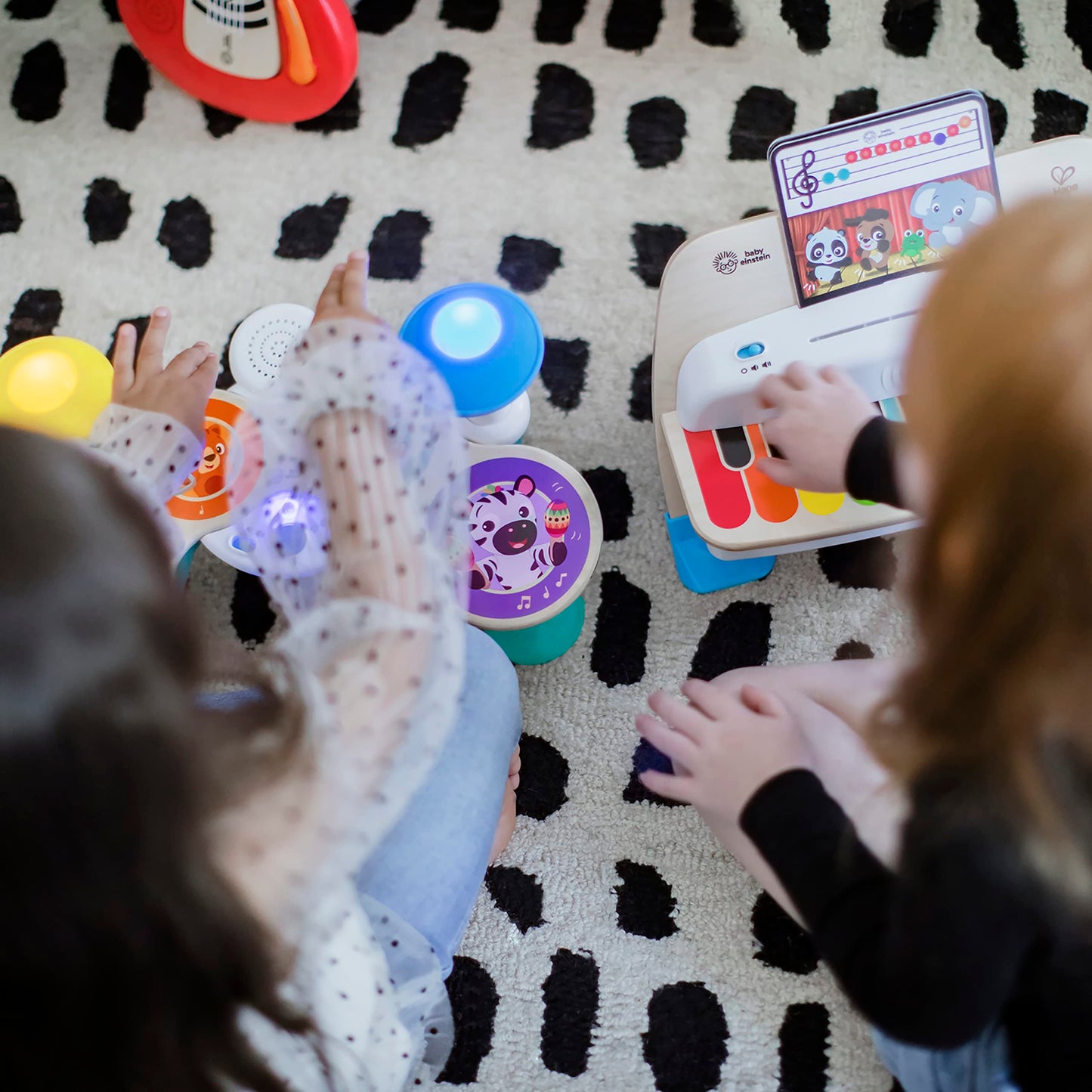 Baby Einstein Together in Tune Drums toddler musical toy with wireless wooden drums and magic touch controls for ages 12 months+.